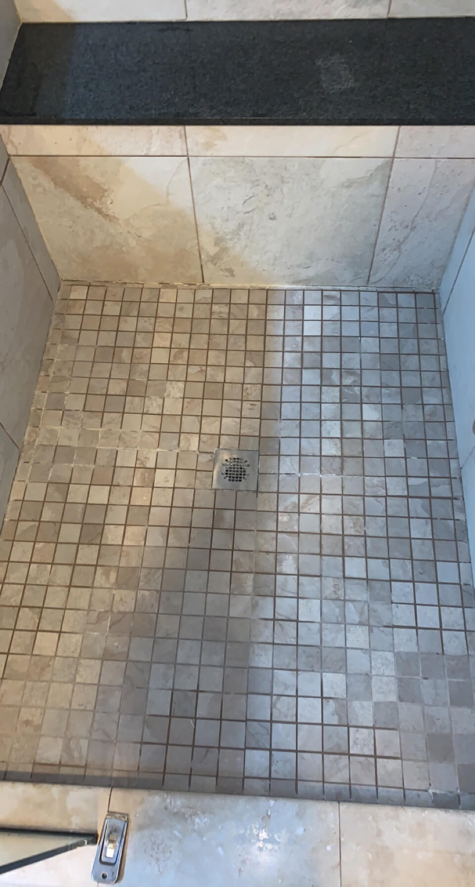 Bathroom tiles before professional re-grouting service in Lynnwood WA - damaged old grout