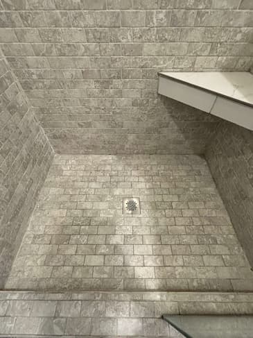 Commercial space before grout color restoration - dingy gray grout in downtown Bellevue office