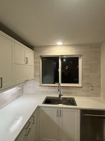Kitchen floor after complete restoration - pristine white grout transformation in Everett