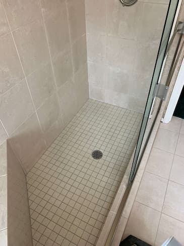 Master bathroom shower after professional restoration - pristine waterproof finish in Seattle
