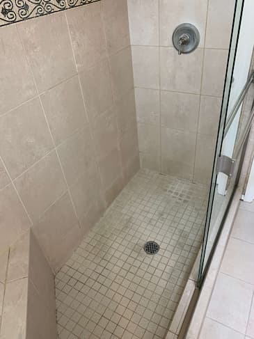 Master bathroom shower before restoration - moldy grout and dirty tiles in Capitol Hill Seattle